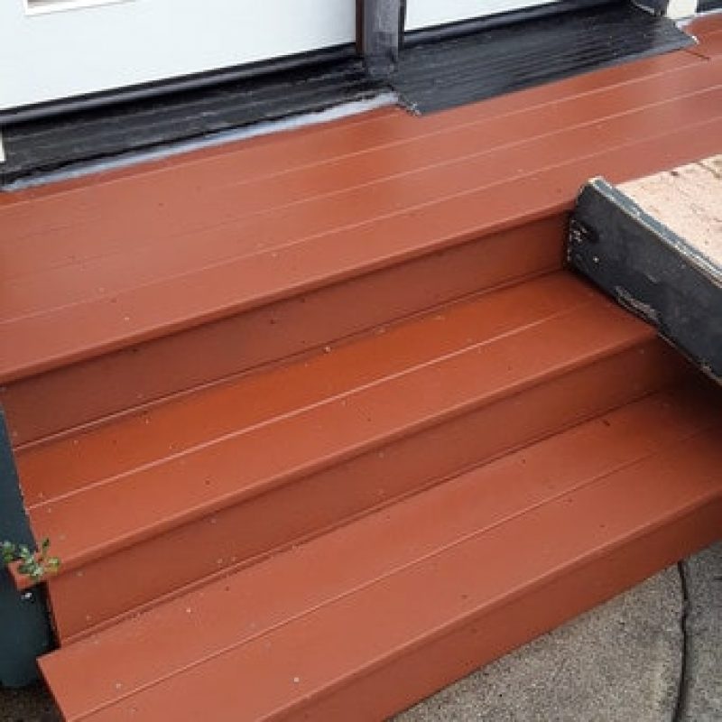 Wood deck back door after pressure washed